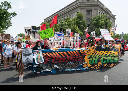 Thousands march on Pennsylvania Ave for The Peoples Climate Movement in Washington D.C. April 29, 2017. They are marching to stand up for climate, jobs and justice and demand a new clean energy economy that creates good jobs and fights inequality and injustice. There are over 375 sister marches planned across the United States and around the world, from Japan to Brazil.          Photo by Ken Cedeno/UPI Stock Photo