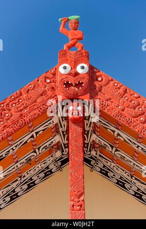 Wooden gable with traditional carving, House of Maori, Whakarewarewa, Rotorua, Bay of Plenty, North Island, New Zealand Stock Photo