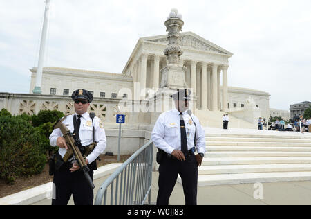 Supreme Court Police Officers stand on guard outside the Supreme Court where the newest justice, Neil Gorsuch is expected to have a photo-op with Chief Justice John Roberts, at the Supreme Court in Washington, DC on June 15, 2017.        Photo by Pat Benic/UPI Stock Photo