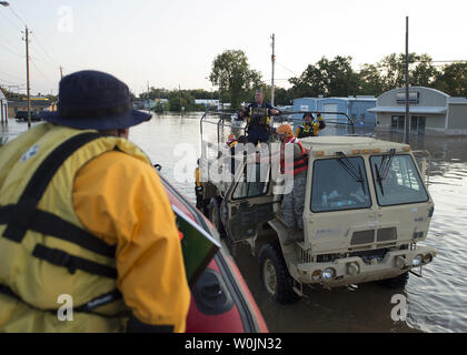 Members of Army National Guard, with Texas Military Department’s 36th Sustainment Brigade, comprised of multiple Army National Guardsmen and members of New Jersey Task Force 1,  conduct high water rescue operations in Wharton, Texas, August 31, 2017, due to devastating effects caused by Hurricane Harvey’s aftermath. Harvey made landfall into the Texas coast last week as a category 4 hurricane. Air National Guard photo by Photo by Senior Master Sgt. Robert Shelley/Air National Guard Stock Photo