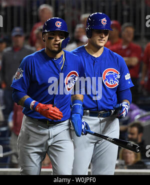 Chicago Cubs Addison Russell makes a catch on a pop up off the bat of St.  Louis Cardinals Magneuris Sierra while Javier Baez waits as a backup in the  sixth inning at