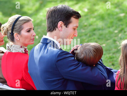 President Donald Trump daughter Ivanka sits next to her husband Jared Kushner as he holds their son Joseph as they attend the annual Thanksgiving Turkey Pardoning Ceremony in the Rose Garden at the White House on November 21, 2017 in Washington, D.C. President Trump pardoned a turkey named Drumstick who, along with an alternate named Wishbone, will join past pardoned turkeys at Gobblers Rest on the campus of Virginia Tech University.  Photo by Kevin Dietsch/UPI.. Stock Photo