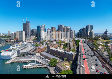 Cruise ship docked at Circular Quay with the skyline of Sydney Central Business District behind, taken from the Harbour Bridge, Sydney, Australia Stock Photo
