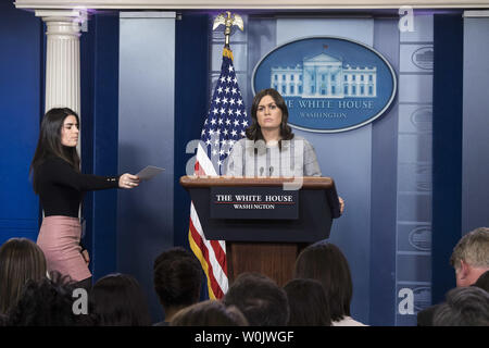 White House press aide Giovanna Coia hands a note to White House Press Secretary Sarah Huckabee Sanders as she holds the daily press briefing at the White House in Washington, D.C. on January 3, 2018. Photo by Kevin Dietsch/UPI Stock Photo