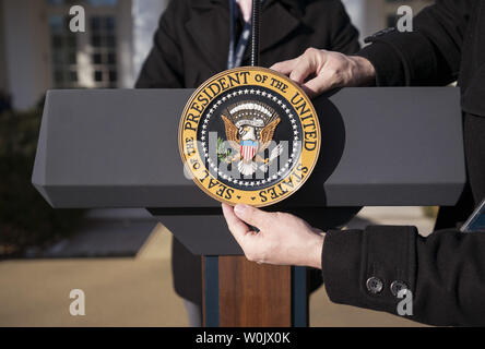 White House staff place the Presidential Seal on President Donald Trump's podium prior to an event where Trump addressed members of the March for Life event, at the White House in Washington, D.C. on January 19, 2018. Photo by Kevin Dietsch/UPI Stock Photo