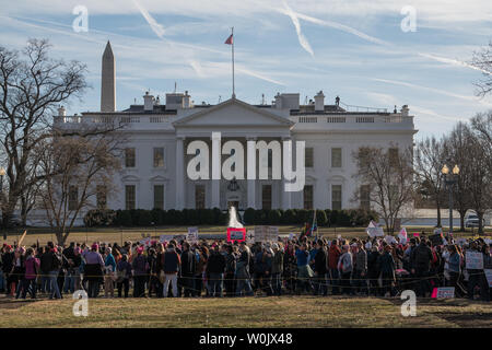 A crowd of supporters gather in front of the White House in support of the Women's March originating from the Lincoln Memorial in Washington, D.C. on January 20, 2018. This is the one year anniversary of the Women's March where hundreds of thousands gathered in DC and all over the United States in support of women and to protest Donald Trump's election to President of the United States.     Photo by Ken Cedeno/UPI Stock Photo