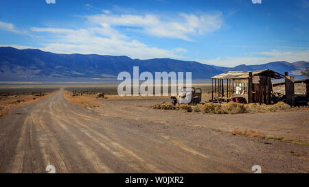 Weathered items rest in the remote Nevada desert Stock Photo