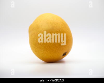 June 2019 – Isolated Yellow Mango On A White Background Stock Photo