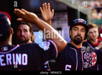 Washington Nationals third baseman Anthony Rendon (R) is congratulated in the dust after scoring off of a Adam Eaton single in the fourth inning at Nationals Park in Washington, D.C. on July 6, 2018. Photo by Kevin Dietsch/UPI Stock Photo