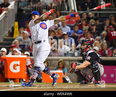 Chicago Cubs Willson Contreras (40) hugs Cleveland Indians Francisco Lindor  before the 2018 Home Run Derby at Nationals Park in Washington, D.C. on  July 16, 2018. Photo by Kevin Dietsch/UPI Stock Photo - Alamy