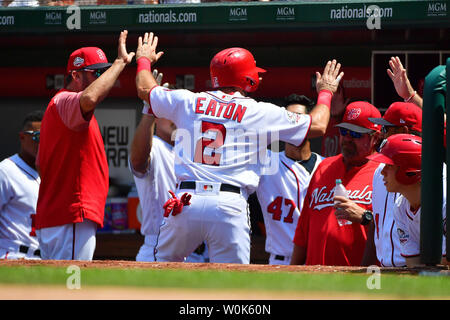 Washington Nationals center fielder Adam Eaton (2) celebrates in the dugout after scoring off of a sacrifice fly from .Anthony Rendon, in the third inning at Nationals Park in Washington, D.C. on August 9, 2018. Photo by Kevin Dietsch/UPI Stock Photo