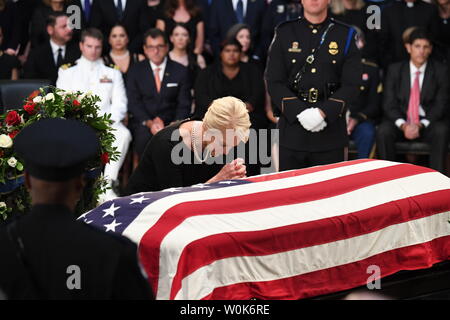 Wife Cindy McCain prays by the casket of former Senator John McCain as he lies in state at the U.S. Capitol in Washington, DC on Friday, August 31, 2018.  McCain, an Arizona Republican, presidential candidate, and war hero, died August 25th at the age of 81. He is the 31st person to lie in state at the Capitol in 166 years.    Photo by Pat Benic/UPI Stock Photo