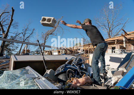 Ryan Jenkins tosses a cinder block away from his dad's $32,000 'Big Dog Mastif' bike that was buried in debris  after Hurricane Michael slammed into Panama City October 12, 2018. Michael hit the Florida coast October 10 as a Category 4 near Mexico Beach as the most powerful storm to hit the southern US state in more than a century. Michael made landfall around 1:00 pm Eastern time (1700 GMT), the National Hurricane Center said.    Photo by Ken Cedeno/UPI Stock Photo