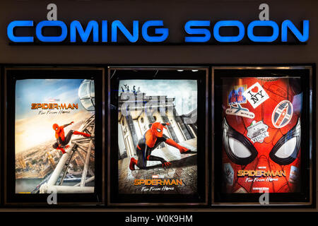 Bangkok, Thailand - Jun 26, 2019: Spider-Man: Far From Home movie poster with coming soon display showing in theatre. Cinema promotional advertisement Stock Photo