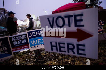 Volunteers wait outside the polling location at Loudon County High School in Leesbugh, Virginia on November 6, 2018. Americans head to the polls to vote in the midterm elections that will decide control the House of Representatives and the U.S. Senate. Photo by Kevin Dietsch/UPI Stock Photo