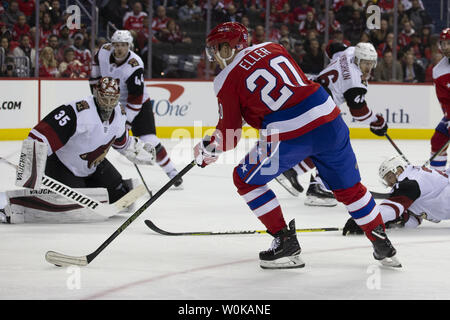 Washington Capitals center Lars Eller (20) shoots on Arizona Coyotes goaltender Darcy Kuemper (35) during the third period at Capital One Arena on November 11, 2018. The Washington Capitals host the Arizona Coyotes to end a multi-game home stand. Photo by Alex Edelman/UPI Stock Photo