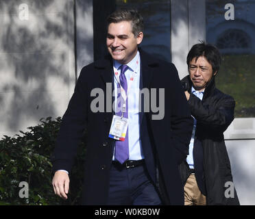 CNN reporter Jim Acosta (L) smiles as he enters the White House grounds after having his White House press pass reactivated following an decision requiring the White House to immediately return Acosta's press pass by U.S. District Judge Timothy Kelly on November 16, 2018 in Washington, D.C.  CNN's Acosta's press pass was revoked following a recent President Donald Trump press conference.  Photo by Pat Benic/UPI Stock Photo