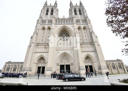 The hearse carrying the casket arrives at the National Cathedral for the funeral of former President George Herbert Walker Bush in Washington D.C. on December 5, 2018.   Photo by Pat Benic/UPI Stock Photo