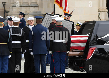 The casket of former President Georrge H.W. Bush arrives at of the National Cathedral for his funeral in Washington D.C. on December 5, 2018.   Photo by Pat Benic/UPI Stock Photo