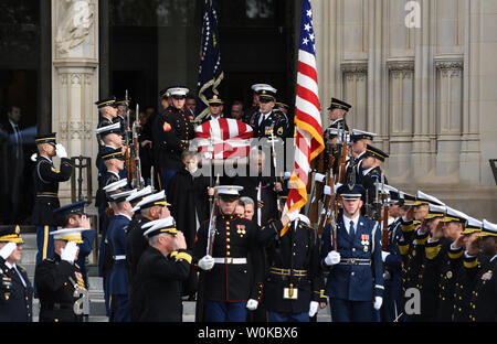 The casket of President George Herbert Walker Bush is carried out of the National Cathedral following the funeral of the 41st  President of the United States in Washington D.C. on December 5, 2018.   Photo by Pat Benic/UPI Stock Photo
