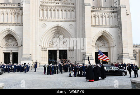 The casket of President George Herbert Walker Bush is taken out of the National Cathedral following the funeral of the 41st  President of the United States in Washington D.C. on December 5, 2018.   Photo by Pat Benic/UPI Stock Photo