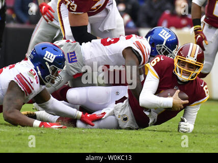 Washington Redskins quarterback Mark Sanchez (6) looks for a receiver in  first quarter action during the game against the New York Giants at FedEx  Field in Landover, Maryland on Sunday, December 9