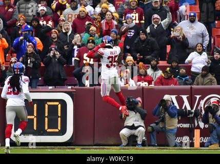 New York Giants free safety Curtis Riley (35) leaps into the end zone as he celebrates a 9-yard interception and touchdown over the Washington Redskins during the first half of an NFL game at FedEx Field in Landover, Maryland, December 9, 2018. Photo by David Tulis/UPI Stock Photo