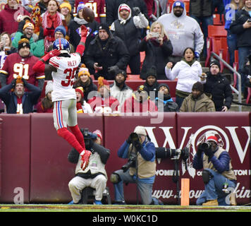 New York Giants free safety Curtis Riley (35) leaps into the end zone as he celebrates a 9-yard interception and touchdown over the Washington Redskins during the first half of an NFL game at FedEx Field in Landover, Maryland, December 9, 2018. Photo by David Tulis/UPI Stock Photo