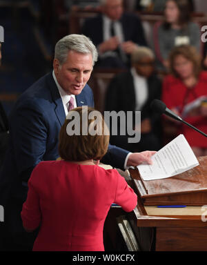 Congresswoman Nancy Pelosi (D-CA ) newly elected Speaker of the House of the 116th U.S. Congress, takes the gavel from House Minority Leader Kevin McCarthy in the House Chamber on Capitol Hill in Washington, DC on January 3, 2019. Pelosi, 52nd Speaker of the House, became the first official to return to that position since Sam Rayburn in 1955.   Photo by Pat Benic/UPI Stock Photo