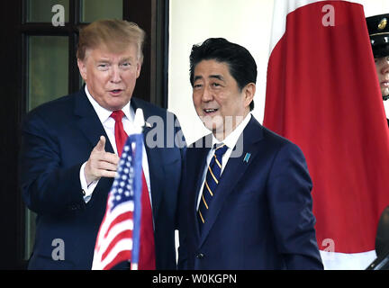 President Donald Trump points to photographers as Japanese Prime Minister Shinzo Abe arrives at the White House, April 26, 2019, Washington, DC. The leaders are expected to discuss bilateral issues, ahead of Japan hosting the G20 Summit in Osaka, Japan in June.         Photo by Mike Theiler/UPI Stock Photo