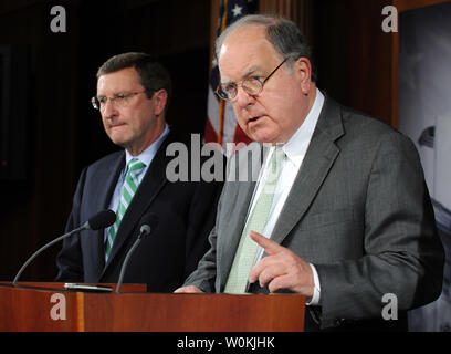 Sen. Kent Conrad, D-ND, (L) and Rep. John Spratt, D-SC, react to the fiscal year 2010 budget proposed by U.S. President Barack Obama on Capitol Hill in Washington on February 26, 2009.  (UPI Photo/Roger L. Wollenberg) Stock Photo