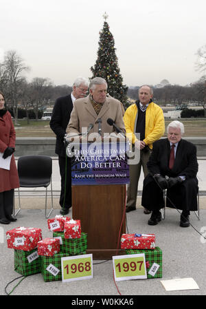 House Minority Whip Steny Hoyer, D-Md., center, speaks at a joint news conference with  Sen. Edward Kennedy, D-Mass., and Rep. George Miller, D-Calif., outside of the U.S. Capitol building in Washington, December 14, 2005. Senate and Congress democrats hold a news conference to discuss 'the true meaning of Christmas: hope, generosity, and goodwill toward others.' The lawmakers will call on Congress to raise the national minimum wage before leaving for the year and they will release a report from the Center for Economic and Policy Research detailing the 'difficulty that families living on the m Stock Photo