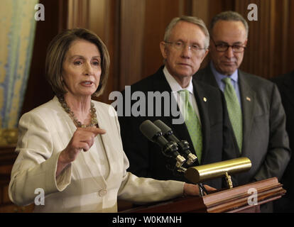 U.S. House Speaker Nancy Pelosi (D-CA) speaks during a joint news conference with Senate Majority Leader Harry Reid (D-NV) and Senator Charles Schumer (D-NY) (R)  about the progress made in President Obama's first 100 days in office on Capitol Hill in Washington on April 29, 2009. (UPI Photo/Yuri Gripas) Stock Photo