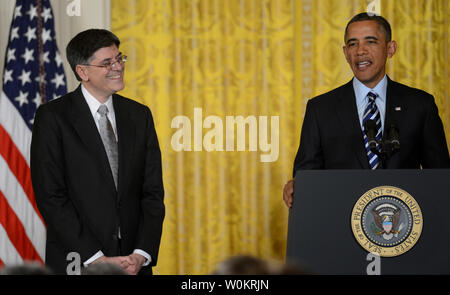 President Barack Obama nominates a smiling Jack Lew who Obama had just  picked as the new Treasury Secretary replacing Tim Geithner in the East Room of the White House in Washington, DC on January 10, 2013.  Obama was discussing Lew's bad handwriting at the time.    UPI/Pat Benic Stock Photo