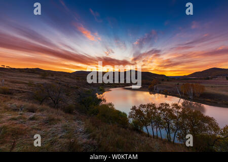 Landscape with mountains, dawn and sky. No one touches nature. Nature. Dusk at night. Outdoor fog. Hills in the autumn. The sun is beautiful, scenic light, valleys, rocks and comfortable weather. Sunrise on the dam. Prairie photography photography color