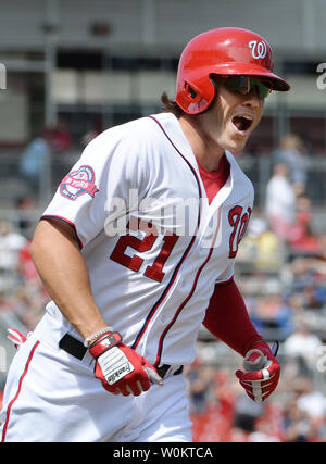 Washington Nationals pinch hitter Matt den Dekker jubilates as he hits a game-winning two-run home run in the bottom of the eighth inning against the Los Angeles Dodgers at Nationals Park in Washington, DC on July 18, 2015.   Nationals won the July 17th suspended game 5-3.  Photo by Pat Benic Stock Photo