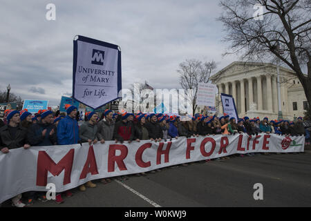 Participants carry a sign during March for Life outside the U.S. Supreme Court in Washington, DC on January 27, 2017. Activists from across the nation participated in the annual pro-life rally protesting abortion and the 1973 Roe v. Wade Supreme Court decision legalizing abortion.  Photo by Molly Riley/UPI Stock Photo