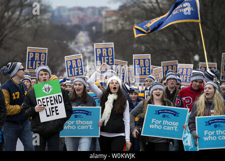 Participants make their way to the Supreme Court during the March for Life in Washington, DC on January 27, 2017. Activists from across the nation participated in the annual pro-life rally protesting abortion and the 1973 Roe v. Wade Supreme Court decision legalizing abortion.  Photo by Molly Riley/UPI Stock Photo