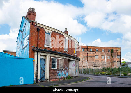 Closed down and boarded up Chronicle local newspaper office in High Street Crewe Cheshire UK Stock Photo