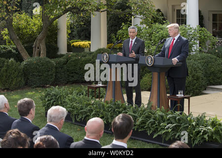 U.S. President Donald Trump (R) and Singapore Prime Minister Lee Hsien Loong make joint statements in the Rose Garden of the White House in Washington, DC on October 23, 2017.   Lee is on a one-day visit to the White House.      Photo by Pat Benic/UPI Stock Photo