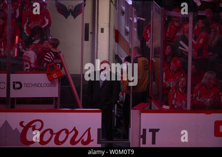 Washington Capitals head coach Barry Trotz looks at the arena video board prior to the start of over time during the NHL playoff game between the Columbus Blue Jackets and Washington Capitals at Capital One Arena in Washington, D.C. on April 12, 2018. Photo by Alex Edelman/UPI Stock Photo