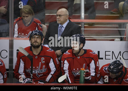 Capitals head coach Barry Trotz looks on behind the bench during the NHL playoff game between the Columbus Blue Jackets and Washington Capitals at Capital One Arena in Washington, D.C. on April 12, 2018. Photo by Alex Edelman/UPI Stock Photo