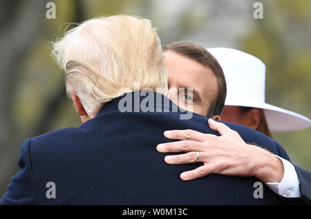 U.S. President Donald Trump hugs French President Emmanuel Macron during official welcoming  ceremony for the State Visit on the South Lawn of the White House on Tuesday, April 24, 2018.   Photo by Pat Benic/UPI Stock Photo