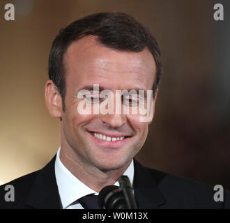 French President Emmanuel Macron smiles at the Elysee palace in Paris ...