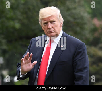 President Donald Trump waves as he arrives via Marine One on the South Lawn of the White House in Washington, DC on September 27, 2018.   The president is returning from New York and the United Nations.   Photo by Pat Benic/UPI Stock Photo