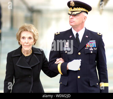 Nancy Reagan passes with her escort Major General Galen B. Jackman ...