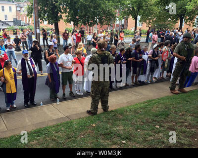 Militia members face off against counter-protesters. Virginia Gov. Terry McAuliffe declared a state of emergency as authorities, including police and members of the National Guard, blocked off sections of Charlottesville, Virginia, on August 12, 2017. The action was in response to violence between supporters of the Alt-Right Unite the Right rally and counter-protesters in and around Emancipation Park, the intended site of the rally. Photo by Virginia State Police/UPI Stock Photo