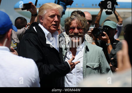 President Donald Trump, with Geraldo Rivera, arrives in Carolina, Puerto Rico, on October 3, 2017, to assess the relief efforts taking place on the island following the devastation caused by Hurricane Maria. The adjutant general of Puerto Rico, Brig. Gen. Isabelo Rivera, along with Lt. Gen. Jeffrey Buchanan, US Army North Commanding General, and the Governor Ricardo Rossello, welcomed the president on his arrival to the island. Photo by Sgt. Jose Ahiram Diaz/PRNG/UPI Stock Photo