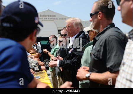 President Donald Trump arrives in Carolina, Puerto Rico, on October 3, 2017, to assess the relief efforts taking place on the island following the devastation caused by Hurricane Maria. The adjutant general of Puerto Rico, Brig. Gen. Isabelo Rivera, along with Lt. Gen. Jeffrey Buchanan, US Army North Commanding General, and the Governor Ricardo Rossello, welcomed the president on his arrival to the island. Photo by Sgt. Jose Ahiram Diaz/PRNG/UPI Stock Photo