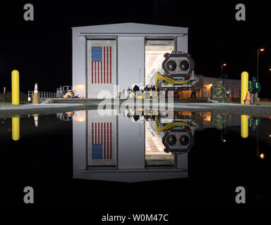 The Orbital ATK Antares rocket is rolled from the Horizontal Integration Facility (HIF) to launch Pad-0A, on November 9, 2017, at NASA's Wallops Flight Facility in Virginia. Orbital ATK's eighth contracted cargo resupply mission with NASA to the International Space Station will deliver over 7,400 pounds of science and research, crew supplies and vehicle hardware to the orbital laboratory and its crew. NASA Photo by Bill Ingalls/UPI Stock Photo